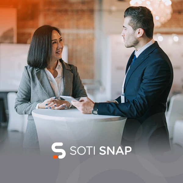 SOTI SNAP. Two coworkers talking to one another